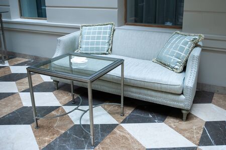 Sofa, two chairs and a table in a modern room