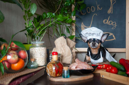 Juicy red apples in a basket on a textured table background, top view, flat lay. Apple cooking and harves themeの写真素材