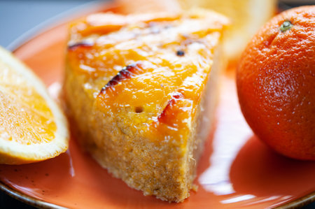 Orange cake or pie. Cozy home baking concept. Still life with delicious pie, tea surrounded by citrus fruitsの写真素材