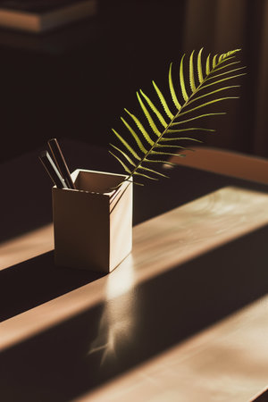 Sunlit desk organizer with greenery, ideal for home decor. AI Generated.の素材