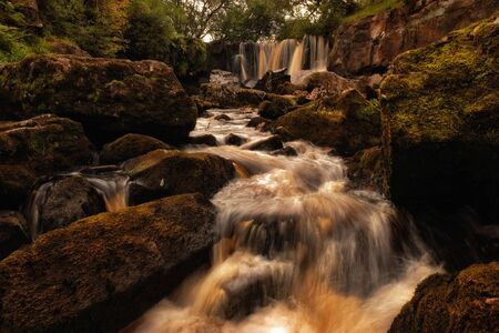 Scenic, long exposure image of mountains creek with waterfalls, irelandの写真素材