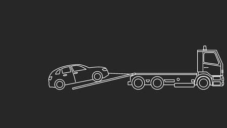 Tow truck picking up on a black backgroundの写真素材