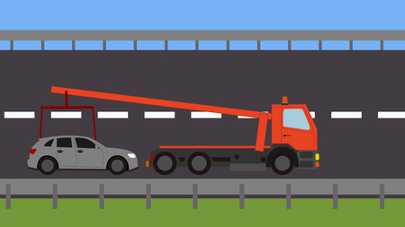 Tow truck picking up a vehicle on the roadの写真素材