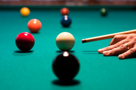 Snooker - Close-up shot of a man playing billiard