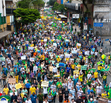Sao Paulo, Brazil - November 15. Some protesters marching on Paulista Avenue holding signs with messages against the corruption of brazilian goverment. They were also protesting against Foro de Sao Paulo and irregularities on Petrobras on November 15th, 2のeditorial素材