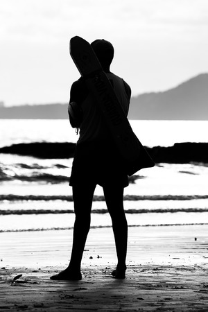 Lifeguard standing by the sea pay attention to the waterの写真素材