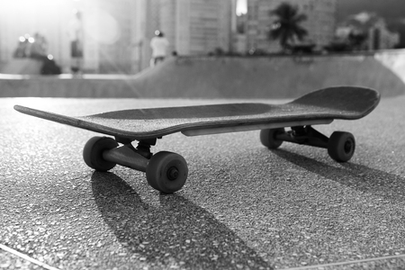 Skateboard on the edge of a bowlの写真素材