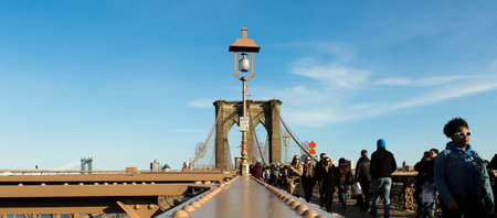 Brooklyn Bridge, New York, April 10, 2016. Tourists walking on the Brooklyn Bridge, New York,のeditorial素材