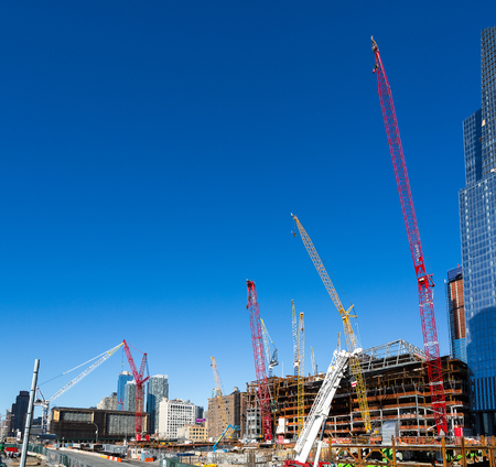 Several buildings being built at the same time in New York, Manhattan