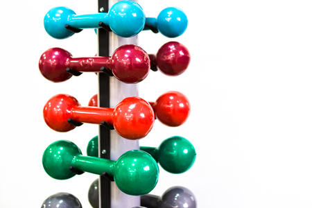 Set of colored isolated dumbbells for sport on a white backgroundの写真素材