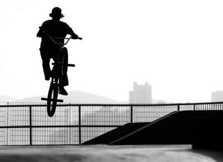 Biker jumping with a bmx bike on a ramp.の写真素材