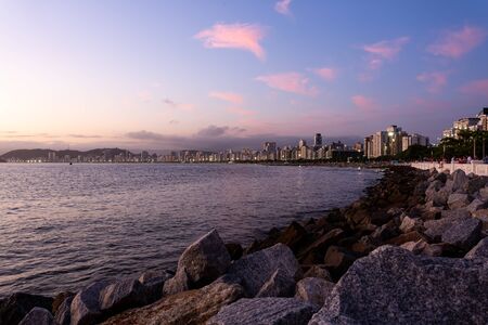 View from the shore of Santos beach during a summer sunset.
