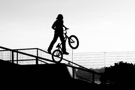 Cyclist jumping in a skateboard park.の写真素材