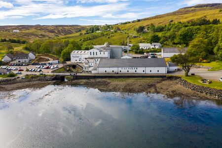 Aerial view of the Talisker Distillery, a single malt Scotch whisky distillery, on the west coast of Skye on the shores of Loch Harport in Carbost on the Isle of Skye, Scotland, UKのeditorial素材