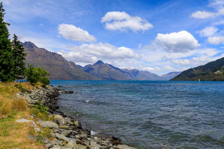 The view from the City Park in Queenstown looking out over Lake Wakatipu and the mountains around. Queenstown, New Zealand.の写真素材
