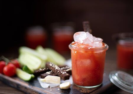 tomato juice with vegetables and rye crackersの写真素材