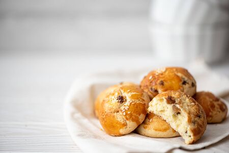 buns with raisins and sesame seeds