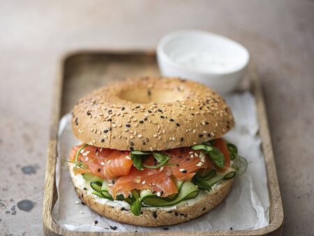 bagel with salted salmon, cucumber and cream cheeseの写真素材