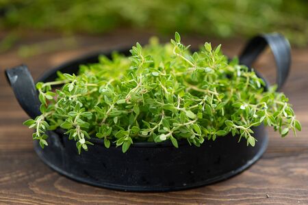 fresh sprigs of thyme on an iron tray