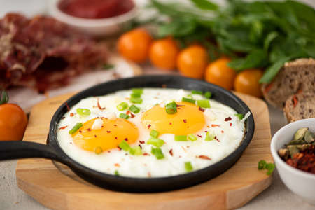 two fried eggs in a small skillet