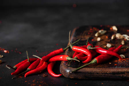 small red hot chili pepper on a black board