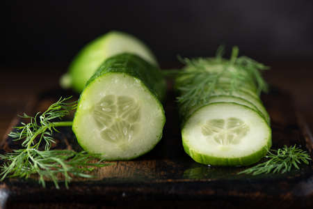 fresh cut cucumber with dillの写真素材