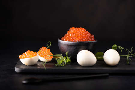 red salmon caviar with quail eggsの写真素材