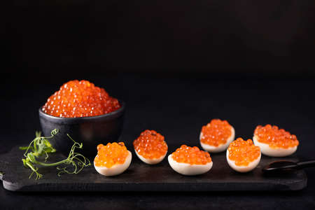 red salmon caviar with quail eggsの写真素材