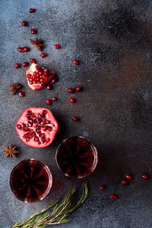 freshly squeezed pomegranate juice in glasses with ripe peeled pomegranate, top viewの写真素材