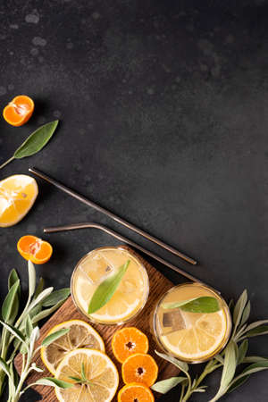 homemade lemonade with lemon slices and ice in glasses, top viewの写真素材