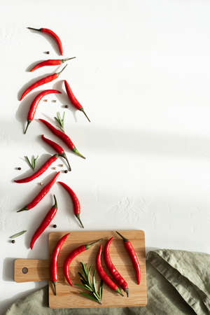 red hot chili pepper on a wooden board, top viewの写真素材