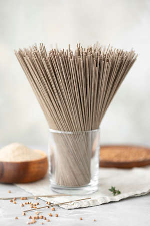 buckwheat noodles on a wooden table, close-upの写真素材