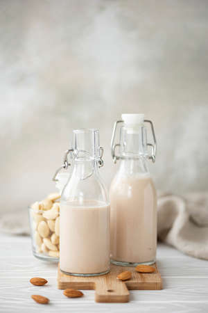 homemade vegetable almond milk in glass bottles close-upの写真素材