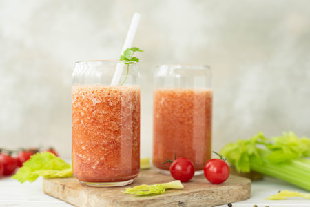 fresh vegetable smoothie from tomatoes and celery in a glass jar, close-upの写真素材