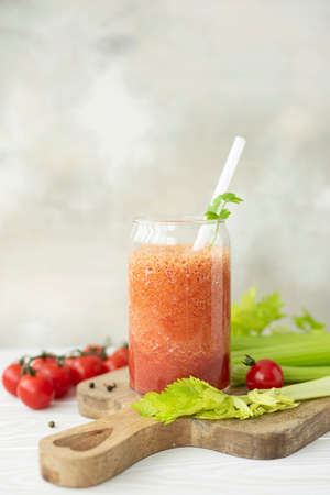 fresh vegetable smoothie from tomatoes, celery and parsley in a glass jar, close-upの写真素材