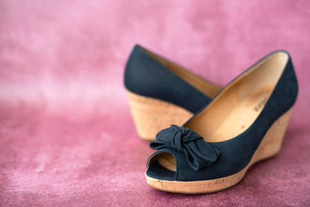 black summer suede women's shoes, side view, close-upの写真素材
