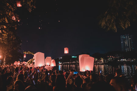 Unidentified people floating lanterns during Loy Krathong festival in Chiang Mai, Thailand.