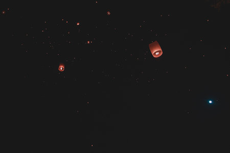 Red lanterns floating in the night sky, Chiang Mai, Thailand