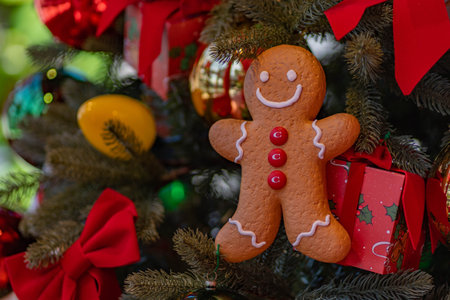 Gingerbread man on the Christmas tree. Christmas and New Year background.