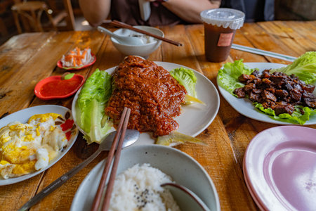 Rice topped with stir-fried pork in traditional thai styleの写真素材