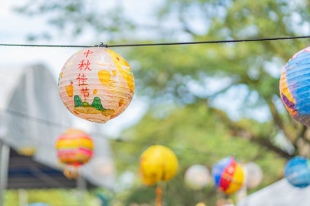 Colorful paper lanterns hanging on the rope in the festival.の写真素材