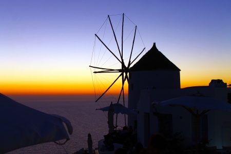 Windmill on the Santorini famous sunsetの写真素材