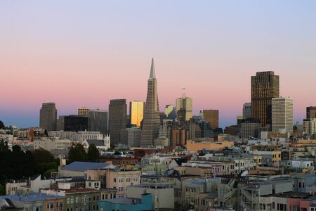 The pink San Francisco sunset with reflectionsの写真素材