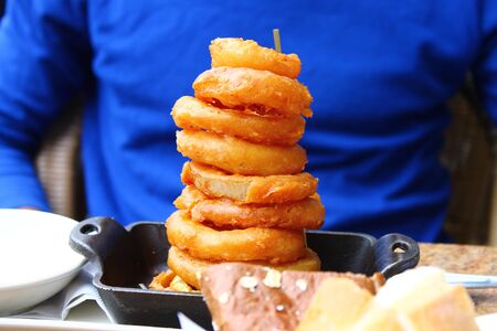 The colored stack of onion ringsの写真素材