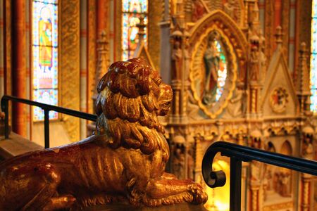 The yellow stone lion in a church in Budapestの写真素材