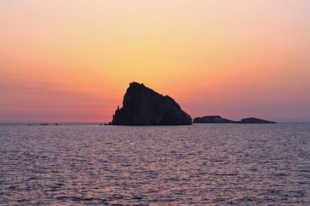 The rock and the colored sunrise in Italy