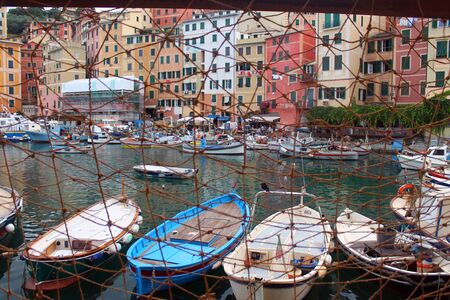 The village behind the fishing netの写真素材