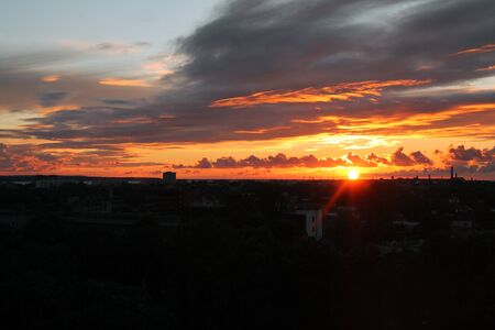 Sunset behind the buildings in the Baltic skyの写真素材