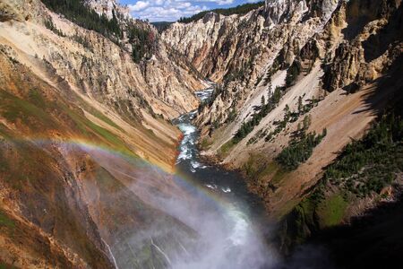 Shiny rainbow over the Grand Canyon of Yellowstoneの写真素材