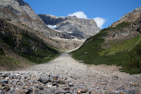 The rocky route to the top of the valley and the peak of the mountains in Canadaの写真素材